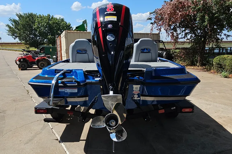 Slide: The Image of 2027 Nitro Z18 XL Pro boat with powerful outboard motor, parked outdoors. - 7
