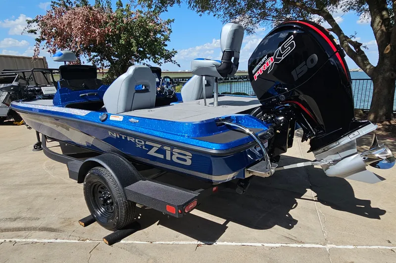 Slide: The Image of 2027 Nitro Z18 XL Pro boat with Mercury Pro XS 150 engine, parked outdoors. - 8