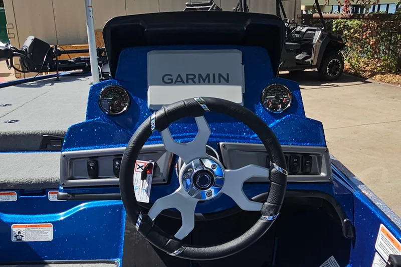 Slide: The Image of Steering wheel and dashboard of 2027 Nitro Z18 XL Pro boat with Garmin display. - 12