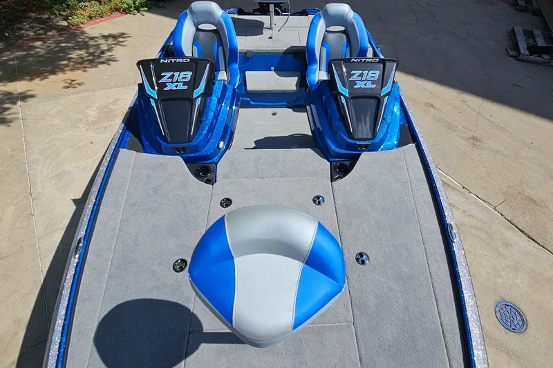 Slide: The Image of 2027 Nitro Z18 XL Pro boat with blue and gray seating, viewed from above. - 13