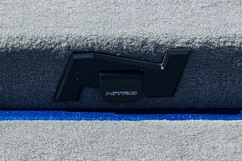 Slide: The Image of Nitro Z18 XL Pro 2027 boat latch on gray carpeted surface. - 15