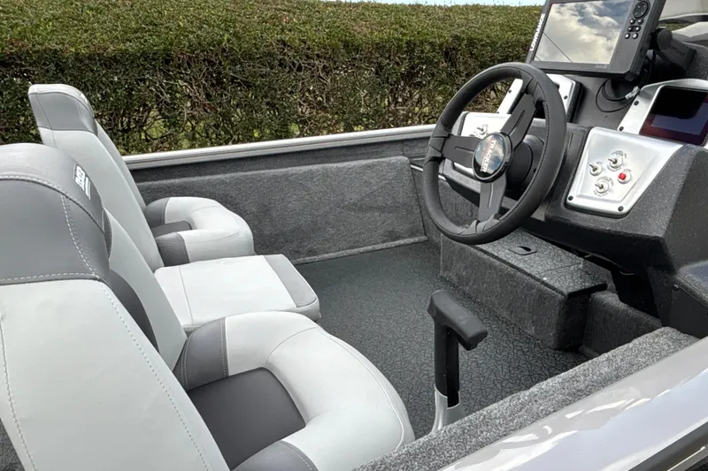 Slide: The Image of Interior of 2027 Tracker Pro Team 175 boat with modern steering and seating. - 14