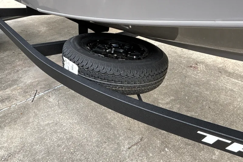 Slide: The Image of 2027 Tracker Pro Team 175 trailer with spare tire mounted underneath. - 31