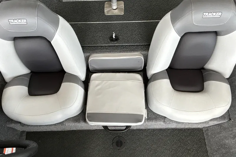 Slide: The Image of 2027 Tracker Pro Team 175 boat seats, gray and black upholstery, top view. - 18