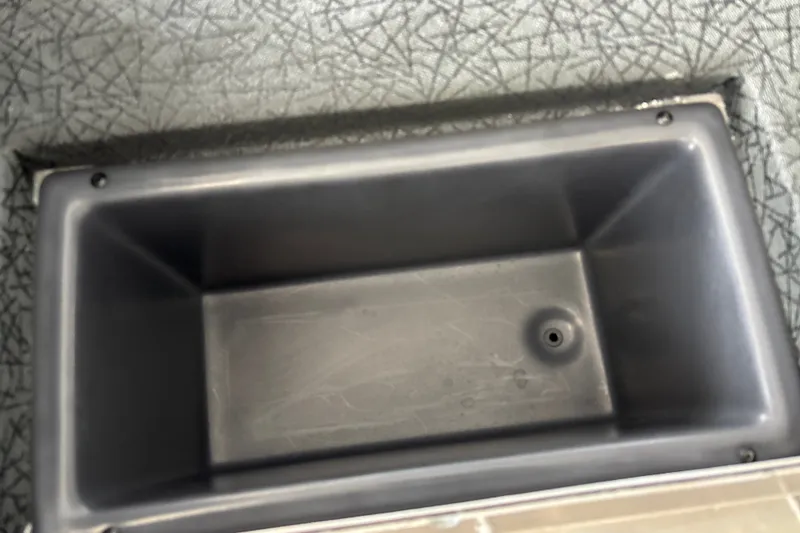 Slide: The Image of Empty storage compartment in 2027 Tracker Pro Team 175 boat. - 24