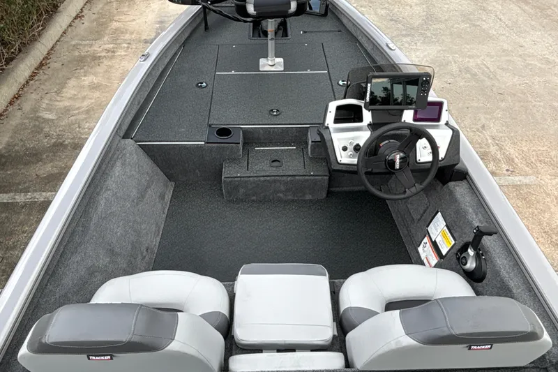 Slide: The Image of 2027 Tracker Pro Team 175 boat interior with steering wheel and seating. - 15