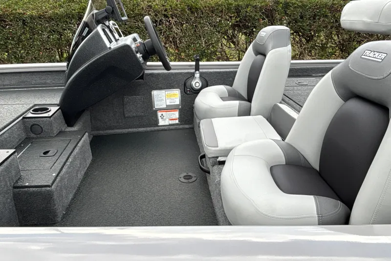 Slide: The Image of 2027 Tracker Pro Team 175 boat interior with gray seating and steering console. - 21