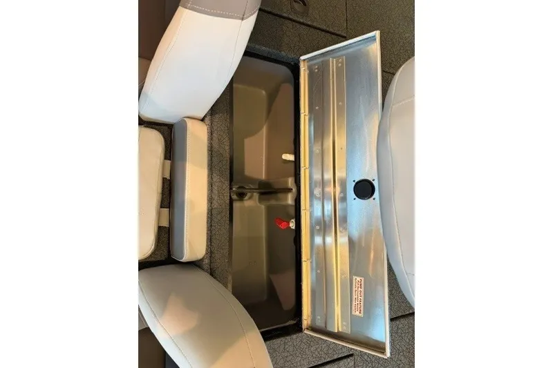 Slide: The Image of 2027 Tracker Pro Team 175 boat storage compartment with open lid and seating. - 15