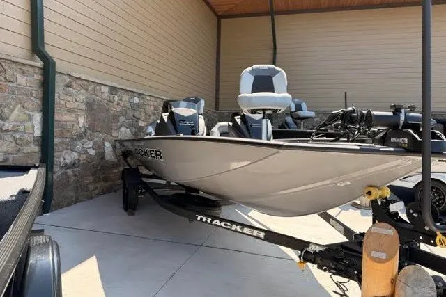 The Image of 2027 Tracker Pro Team 175 boat on trailer, parked outdoors. - 0