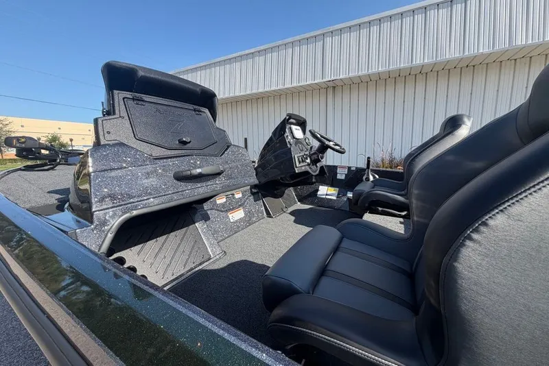 Slide: The Image of 2027 Nitro Z18 XL boat interior with sleek black seats and modern dashboard. - 7