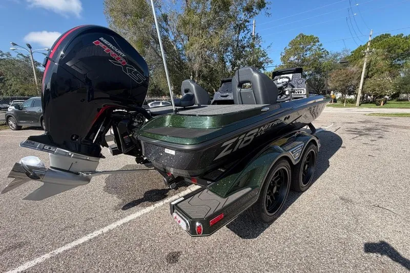 Slide: The Image of 2027 Nitro Z18 XL boat with Mercury Pro XS engine in a parking lot. - 5