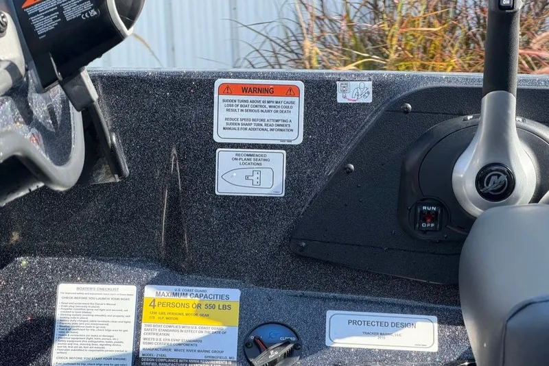 Slide: The Image of Control panel of a 2027 Nitro Z18 XL boat with safety warnings and capacity details. - 13