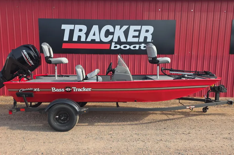 The Image of 2027 Tracker Bass Tracker Classic XL boat in vibrant red, displayed outdoors. - 0