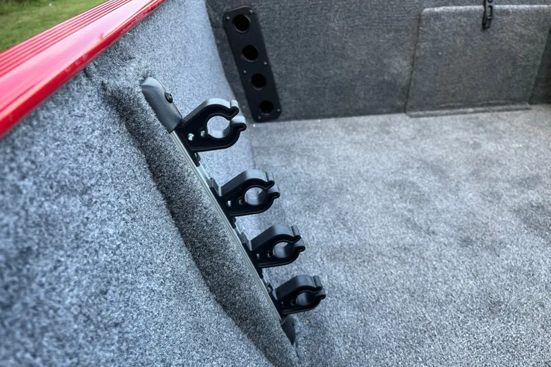 Slide: The Image of 2027 Tracker Bass Tracker Classic XL interior with rod holders and carpeted finish. - 15