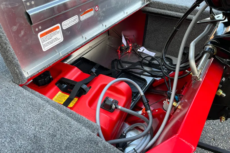 Slide: The Image of Interior view of a 2027 Tracker Bass Tracker Classic XL boat showing fuel tank and wiring. - 12