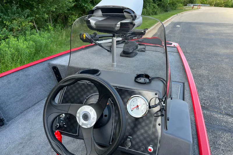 Slide: The Image of 2027 Tracker Bass Tracker Classic XL boat dashboard with steering wheel and RPM gauge. - 20