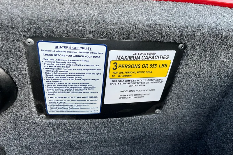 Slide: The Image of 2027 Tracker Bass Tracker Classic XL capacity label and boater's checklist for safety compliance. - 21