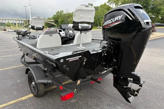 Slide: The Image of 2027 Tracker Pro Team 175 boat with Mercury engine, parked in a lot. - 64