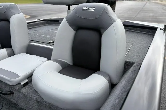 Slide: The Image of 2027 Tracker Pro Team 175 boat seat, gray and black upholstery, sleek design. - 16