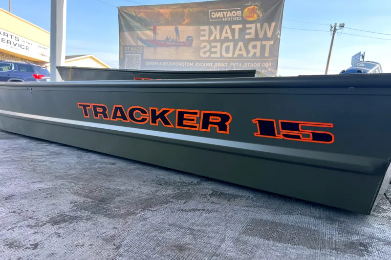 The Image of 2027 Tracker Grizzly 15 Jon boat with bold orange lettering on display. - 0