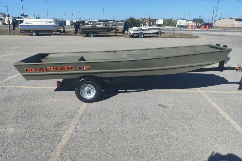 The Image of 2027 Tracker Grizzly 15 Jon boat on trailer in parking lot. - 0