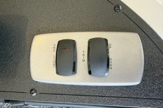 Slide: The Image of 2027 Nitro Z18 XL Pro boat control panel with trim and anchor switches. - 11