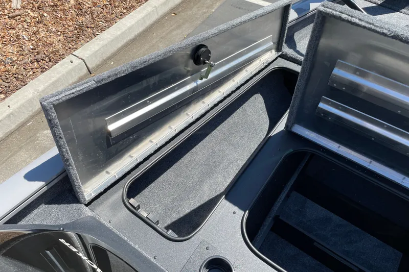 Slide: The Image of Open storage compartments on a 2027 Tracker Pro Team 175 boat. - 23