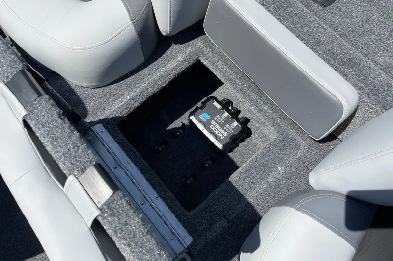 Slide: The Image of 2027 Tracker Pro Team 175 boat interior with storage compartment and battery. - 16
