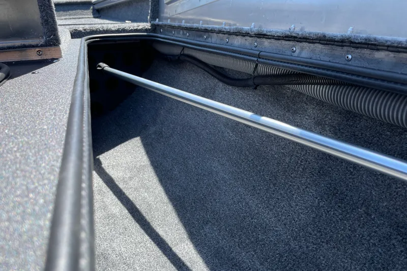 Slide: The Image of Interior view of 2027 Tracker Pro Team 175 boat storage compartment. - 28