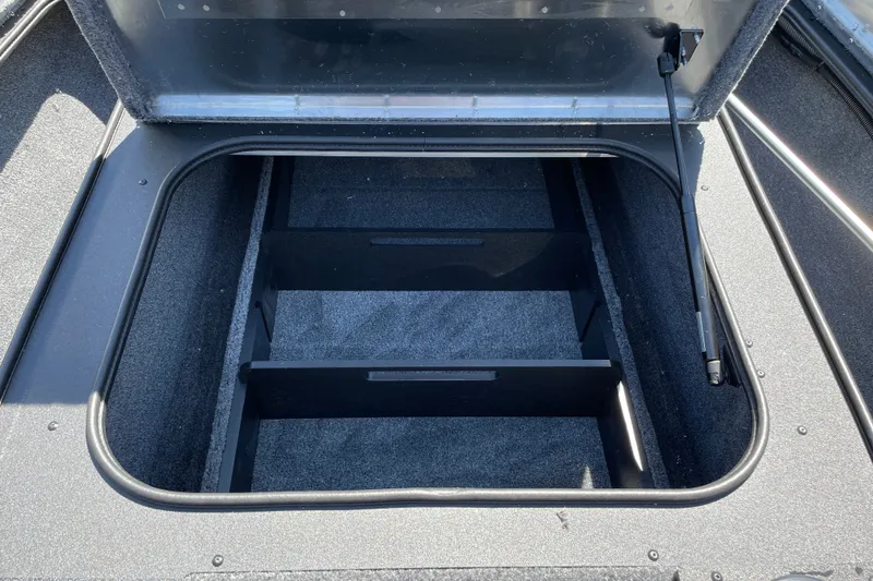 Slide: The Image of Open storage compartment in 2027 Tracker Pro Team 175 boat. - 25