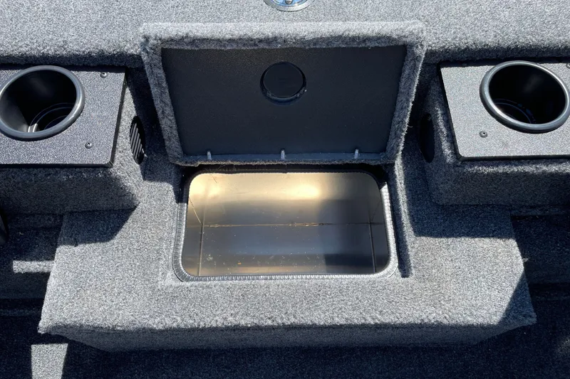 Slide: The Image of Interior storage compartment of 2027 Tracker Pro Team 175 boat with cup holders. - 21