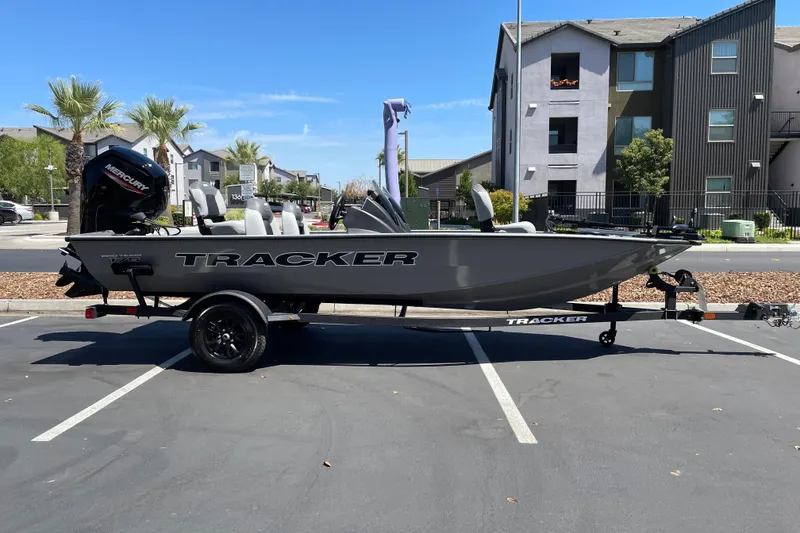 The Image of 2027 Tracker Pro Team 175 boat parked in urban setting, featuring Mercury engine. - 0