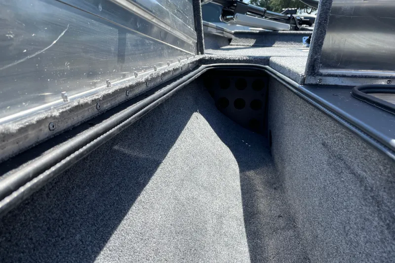 Slide: The Image of Interior view of 2027 Tracker Pro Team 175 boat storage compartment. - 24