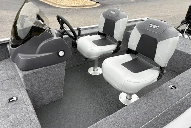 Slide: The Image of 2027 Tracker Super Guide V-16 SC boat interior with dual seats and steering console. - 23