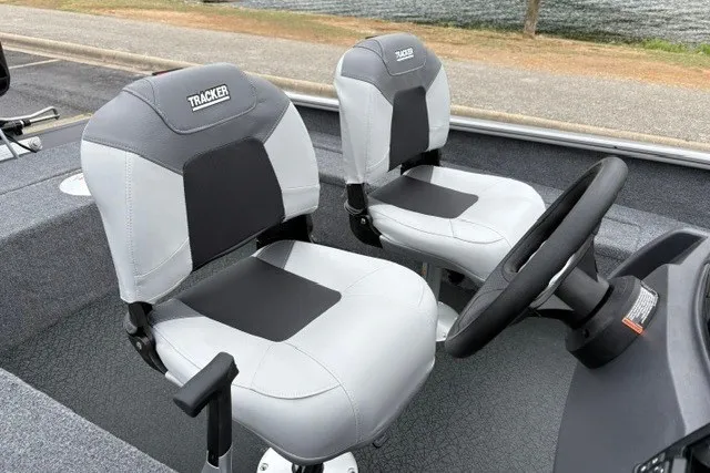 Slide: The Image of 2027 Tracker Super Guide V-16 SC boat seats and steering wheel, featuring sleek design. - 27