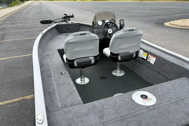 Slide: The Image of 2027 Tracker Super Guide V-16 SC boat interior with dual seats and steering console. - 14