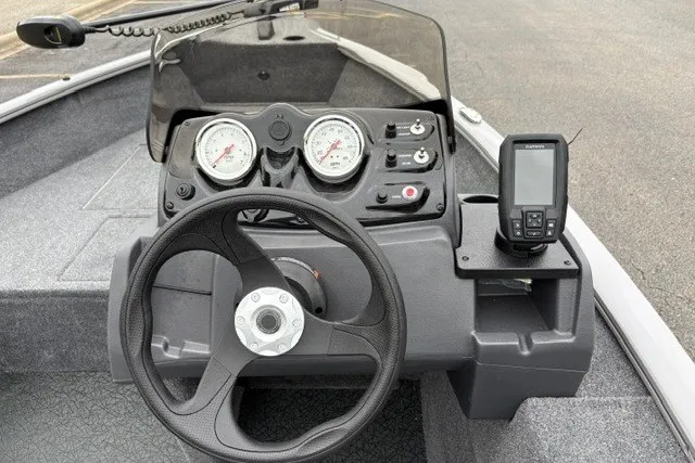 Slide: The Image of 2027 Tracker Super Guide V-16 SC boat dashboard with steering wheel and gauges. - 20