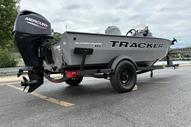 Slide: The Image of 2027 Tracker Super Guide V-16 SC boat on trailer, featuring Mercury outboard motor. - 26