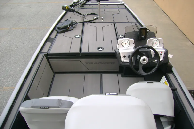 Slide: The Image of 2027 Tracker Pro 170 boat interior with steering wheel and dashboard controls. - 13