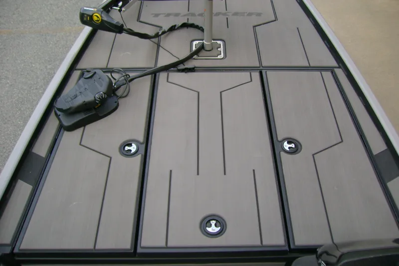 Slide: The Image of 2027 Tracker Pro 170 boat deck with storage compartments and trolling motor. - 16