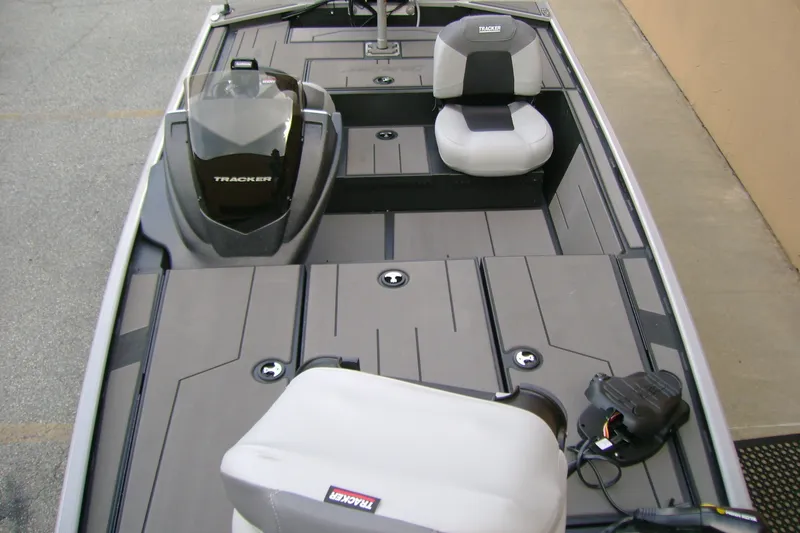 Slide: The Image of 2027 Tracker Pro 170 boat interior with seating and storage compartments. - 41
