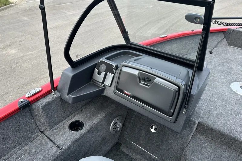 Slide: The Image of 2027 Tracker Pro Guide V-175 Combo boat interior with windshield and storage compartment. - 17