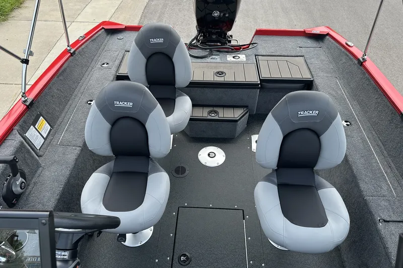 Slide: The Image of 2027 Tracker Pro Guide V-175 Combo boat interior with dual seats and storage compartments. - 15