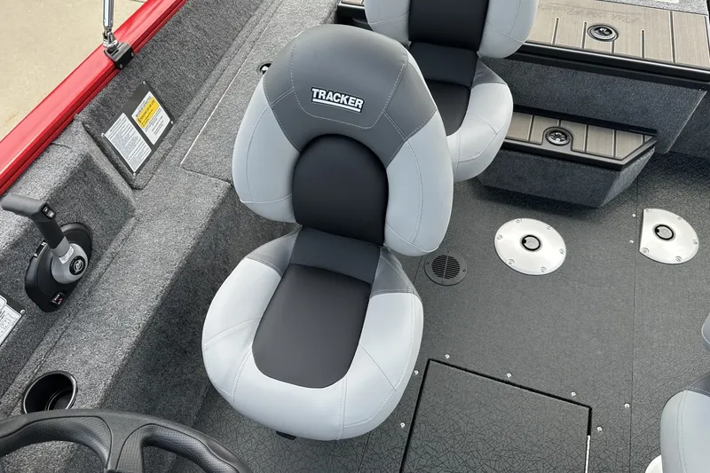 Slide: The Image of 2027 Tracker Pro Guide V-175 Combo boat interior with gray seating and control panel. - 20