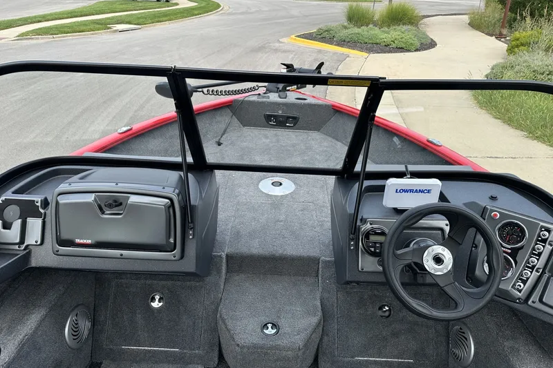 Slide: The Image of Interior view of 2027 Tracker Pro Guide V-175 Combo boat with steering wheel and dashboard. - 16