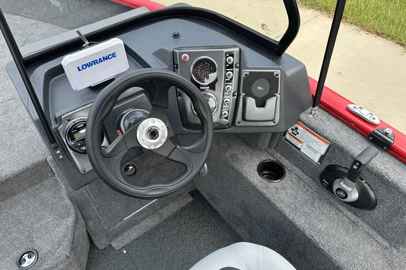 Slide: The Image of 2027 Tracker Pro Guide V-175 Combo boat dashboard with steering wheel and controls. - 19