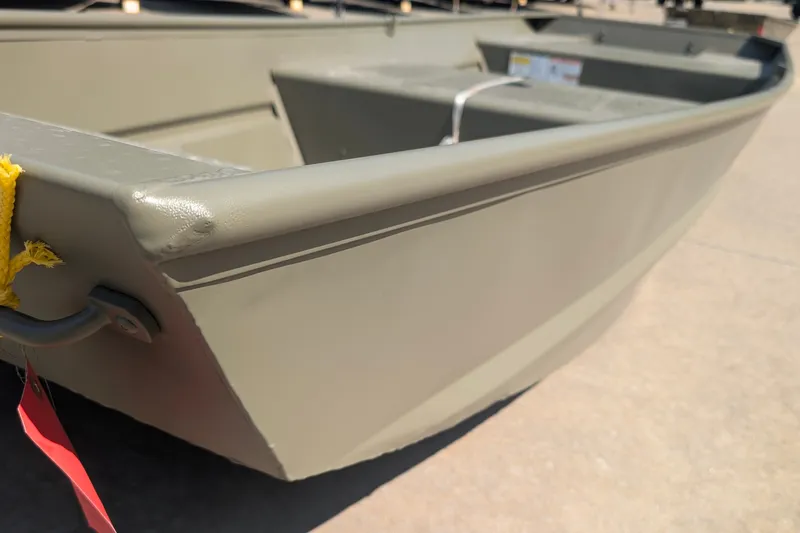 The Image of 2027 Tracker Grizzly 15 Jon boat, close-up view of bow and interior. - 0