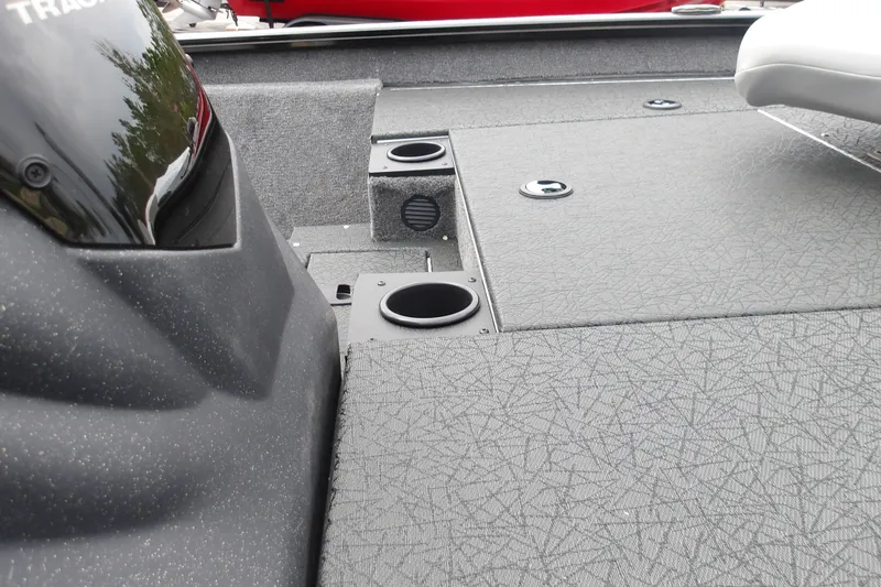 Slide: The Image of 2027 Tracker Pro Team 175 boat interior with cup holders and textured flooring. - 15