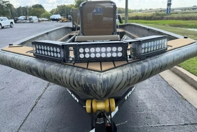 The Image of 2027 Tracker Grizzly 1553 Timber boat with LED lights, parked outdoors. - 0
