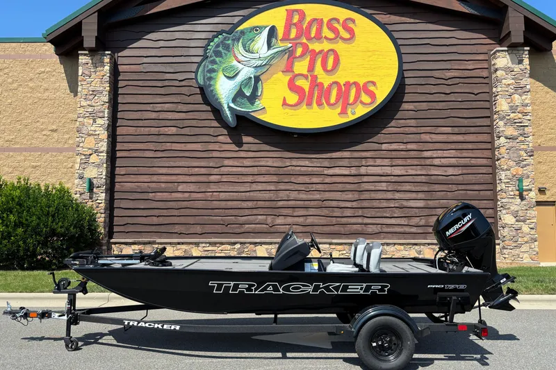 The Image of 2027 Tracker Pro 170 boat displayed outside Bass Pro Shops store. - 0